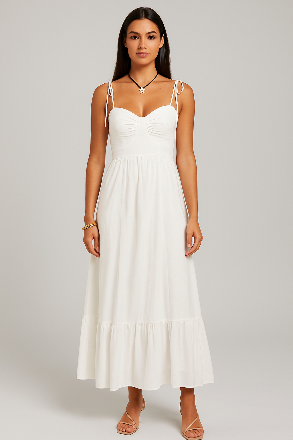 Woman wearing a white dress against a plain background