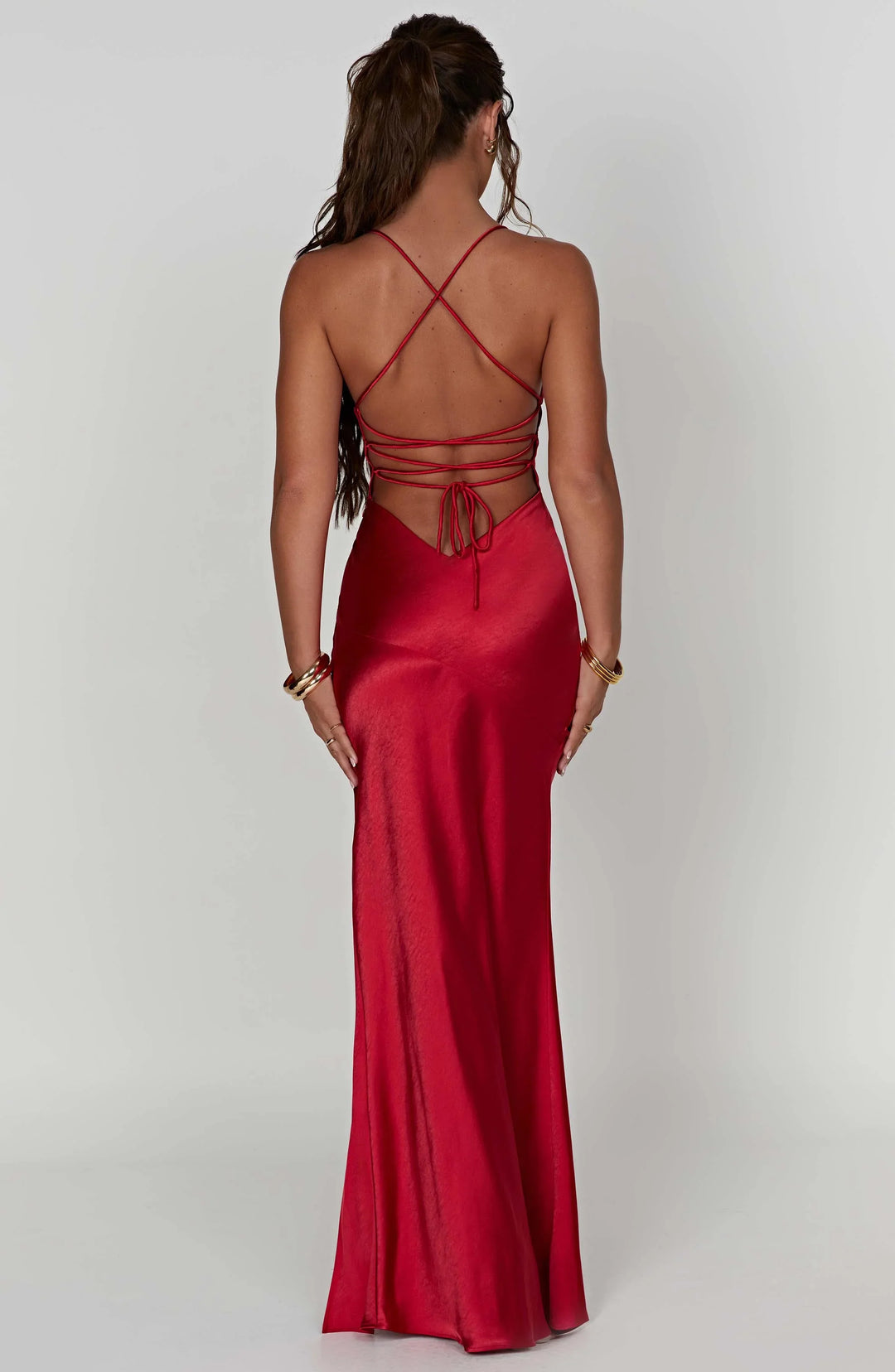 Red evening gown with thin straps on a white background