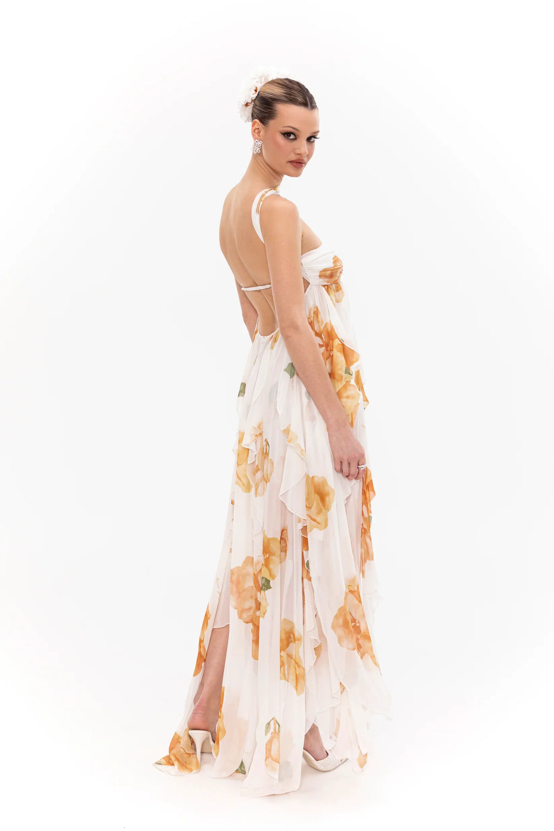 Woman wearing a floral dress on a white background