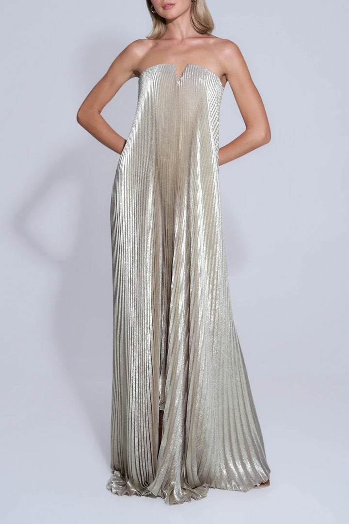 Model wearing gold satin maxi dress with sweetheart neckline in natural sunlight