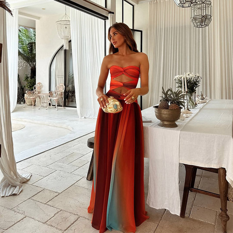 Woman in a strapless red dress standing in a stylish interior setting.