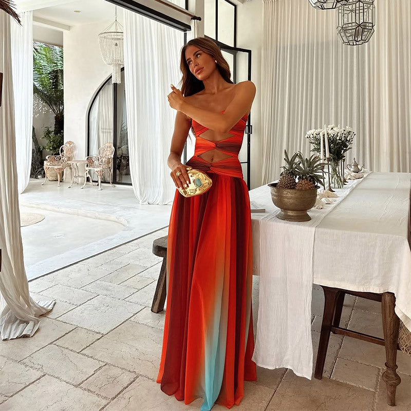 Woman in a colorful dress standing in a stylish interior setting
