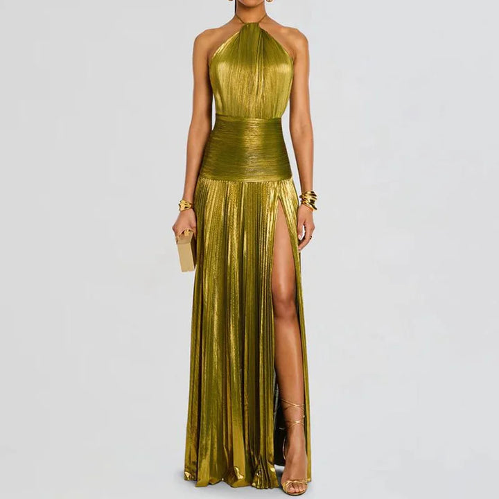 Gold evening gown with a slit on a gray background