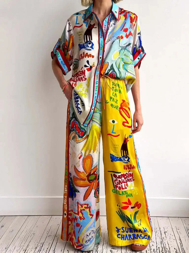 Person wearing a colorful outfit with abstract patterns and text on a white background