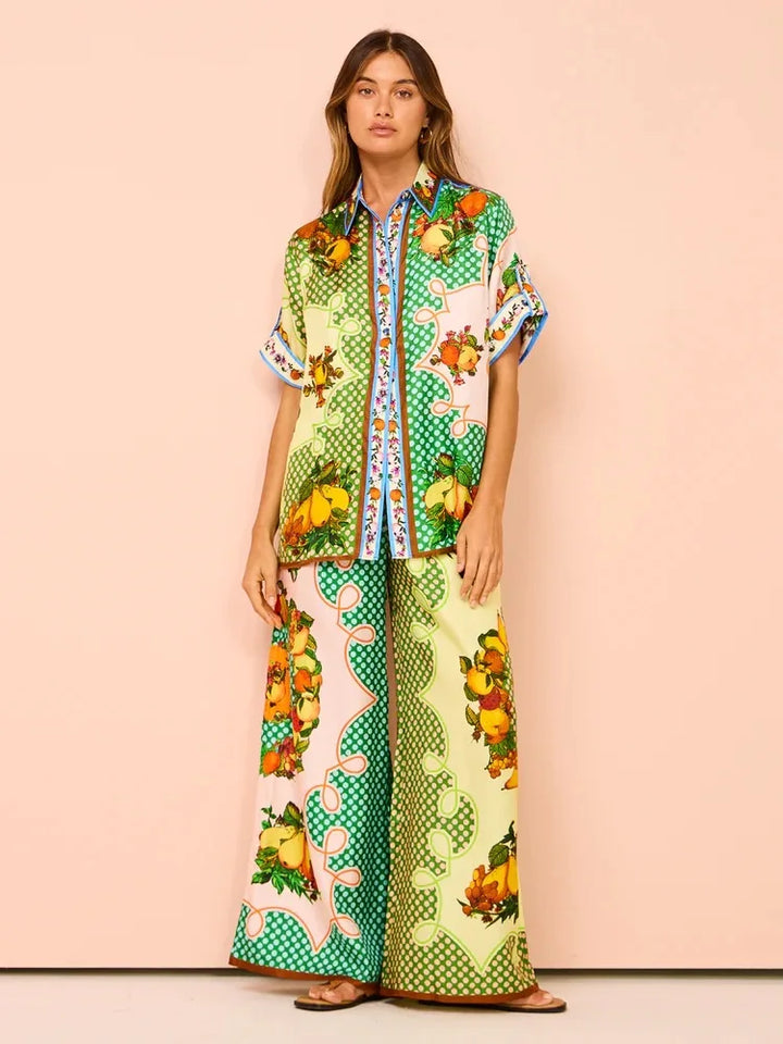 Woman wearing a colorful patterned outfit on a beige background