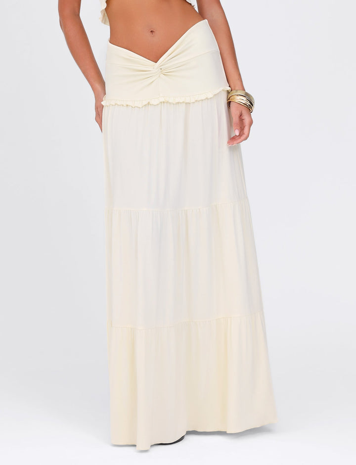 White dress with a bow detail on a white background