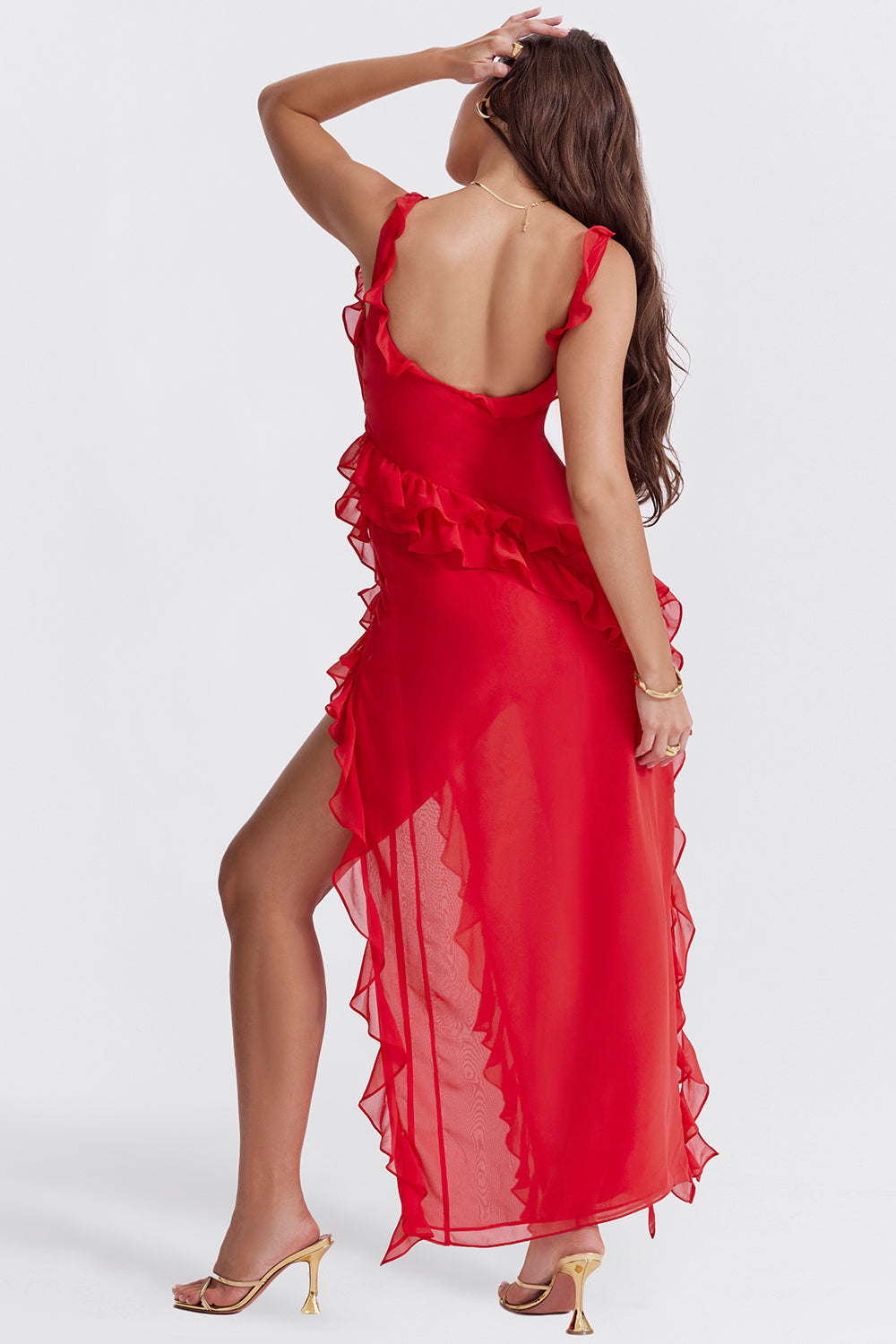 Red dress with ruffled details on a white background