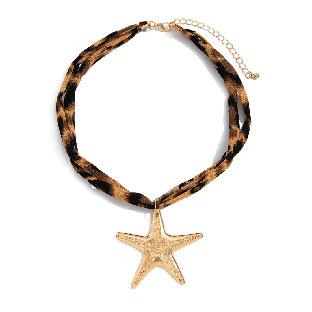 Necklace with tortoiseshell pattern and gold starfish pendant on a white background